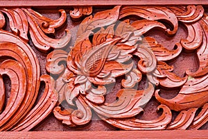 Pattern of carved on wood background on the wall of temple Thailand