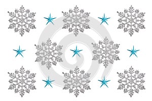 Pattern of Christmas decor in the form of silver snowflakes on a white background. new year concept, top view