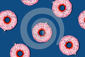Pattern with Christmas tree toy donut on classic blue