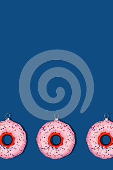 Pattern with Christmas tree toy donut on classic blue