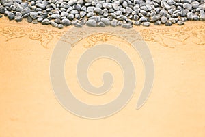 Pattern on clean sand with stones. The concept of peace and cont