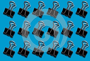 Pattern with a clerical clip on a blue background