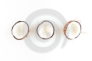 Pattern with coconuts on white background. Tropical abstract background. Flat lay, top view.