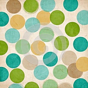 Pattern of colorful circles on a textured off white surface