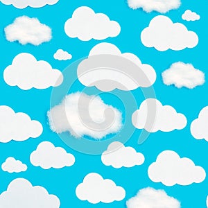 A pattern of cut-out white clouds on a blue background.