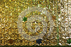 The pattern is decorated with gold decorated with beautiful patterns.Wall pattern in Boda Town Pagoda, Yangon Myanmar.