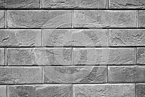 Pattern of decorative gray slate stone wall surface as a background. tinted gray.