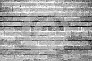 Pattern of decorative gray slate stone wall surface as a background. tinted gray.