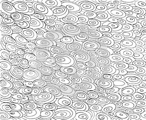 The pattern, drawn by hand with black lines, from careless horizontal ovals of different sizes on a white background