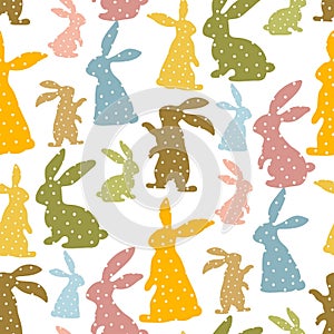 Pattern of Easter bunnies made of polka dot fabric sewn. Rabbit toys for children. Rabbit or hare, a spring festive