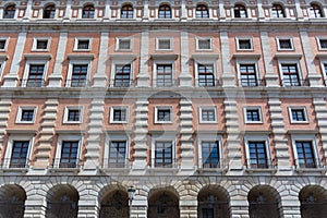 Pattern facade windows and balconies view at the neoclassic military building at the AlcÃ¡zar of Toledo main facade