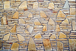 A pattern of flat stones. Grey stone wall background. Surface st