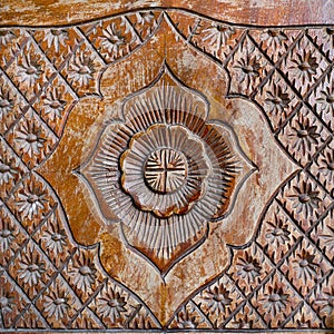 Pattern of flower carved on wood background