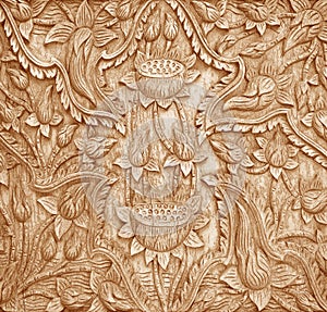 Pattern of flower carved on  wood background on the wall of temple Thailand