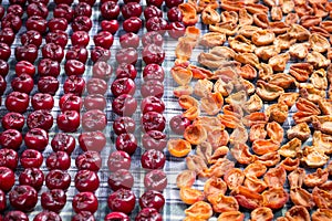 Pattern of fresh mellow cherries and apricots prepared for conservation