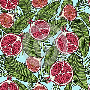 Pattern of fruits pomegranate and fig on the color of leaves. On a blue background.