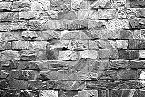 pattern gray color of modern style design decorative uneven cracked real stone wall surface with cement.