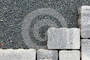 Pattern of grey paving stones at a chip foundation