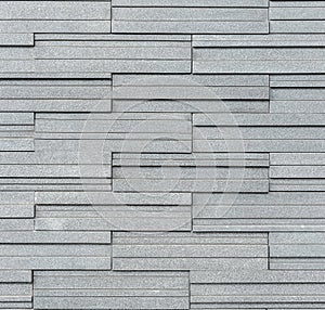 Pattern of grey and rough granite wall texture, background