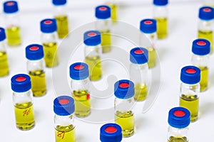 Pattern from HPLC glass vials with yellow fluid. Pharmaceuticals and chemical analysis