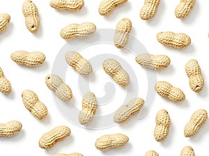 Pattern of individual peanuts on white background