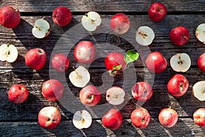 Pattern of Juicy red apples on a textured table background,  top view, flat lay. Apple cooking and harves theme photo