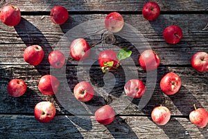 Pattern of Juicy red apples on a textured table background,  top view, flat lay. Apple cooking and harves theme