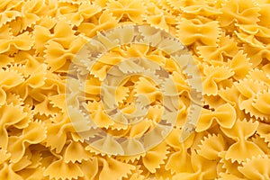 Pattern made of raw farfalle pasta