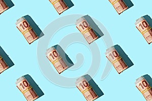 Pattern with money ten euro isolated on blue background