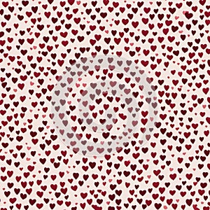 A pattern of numerous small red hearts on a white background