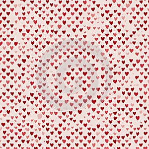 A pattern of numerous small red hearts on a white background