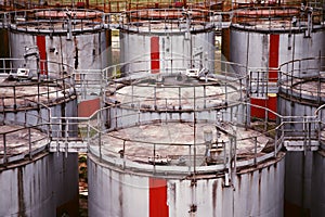 Pattern of old large oil storage tanks