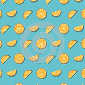 Pattern of oranges slices isolated on blue background.