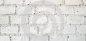 Pattern of painted white grunge brick wall for background
