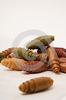 Pattern pastila fruit leather rolls up with fruits on white background. Vertically.