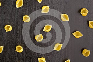 Pattern of A pile of conchiglie paste shells on black background