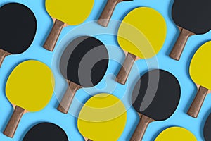 Pattern from ping pong rackets for table tennis on blue background