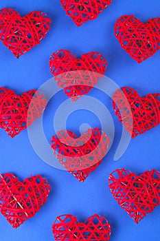 Pattern of the red hearts on the cornflowerblue background.