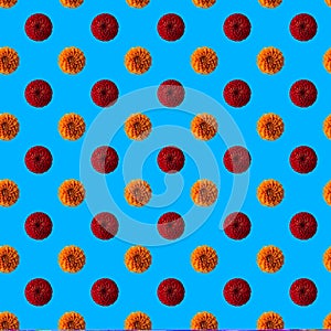 Pattern with red and peach dahlias on blue