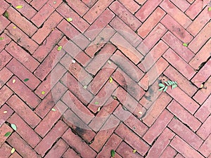 Pattern of Red triangle brick floor is difference texture.