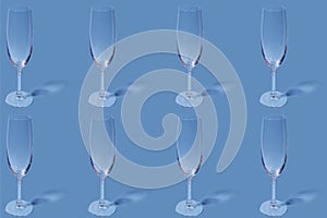 Pattern. Repetition of the image of a champagne glass on a light blue background.