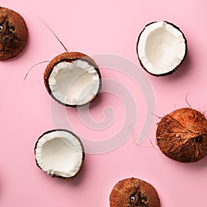 Pattern with ripe coconuts on pink background. Top View. Copy Space. Square crop. Pop art design, creative summer