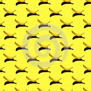 Pattern with ripe yellow banana isolated on a bright background. hard shadows from the sun at noon