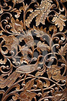 Pattern of rose carved on wood