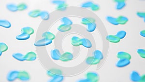 Pattern of Small Blue and Green Blob-like Shapes on a White Background organic