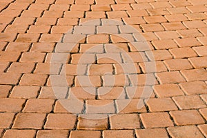 Pattern of small brown brick block from walkway