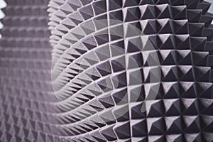 The pattern of the soundproof panel of polyurethane foam. black geometric background