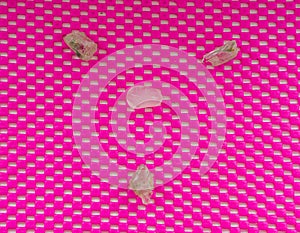 Pattern of spiritual stones, selenite and rose quartz, pink pattern background