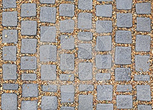 Pattern square stone pavement with gravel background. walking path textures