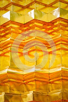 Pattern and texture of gold stucco technic on thai pagoda surface.